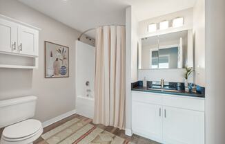 a bathroom with a shower and a sink at Residences at Manchester Place in Manchester New Hampshire