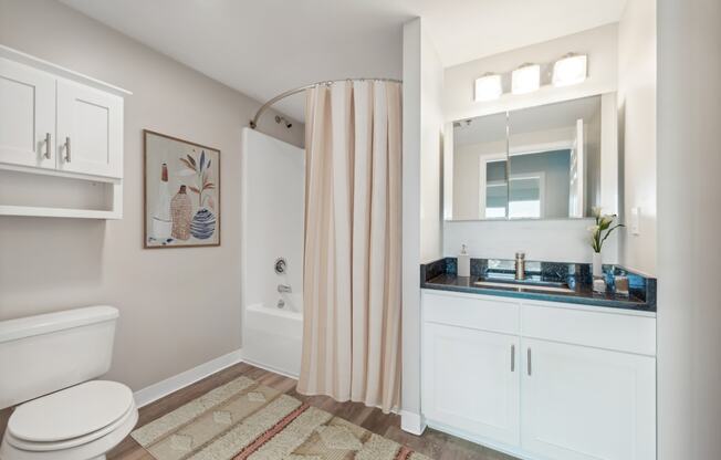 a bathroom with a shower and a sink at Residences at Manchester Place in Manchester New Hampshire