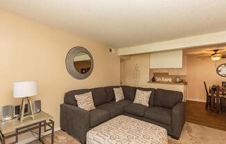 a living room filled with furniture and a table