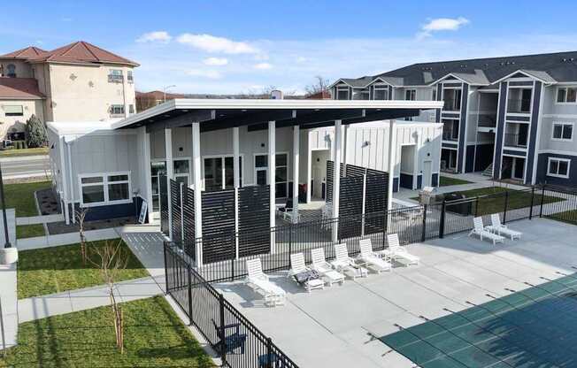 A modern building with a pool in front.