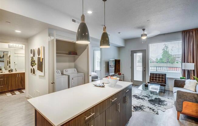 a kitchen and living room in a house  at Affinity 56 Apartments in West Jordan, Utah