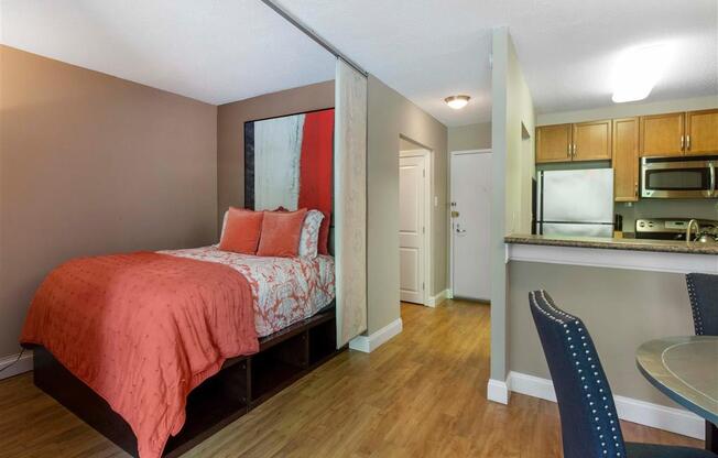 Open Floor Plan with Breakfast Bar off Kitchen and Bed