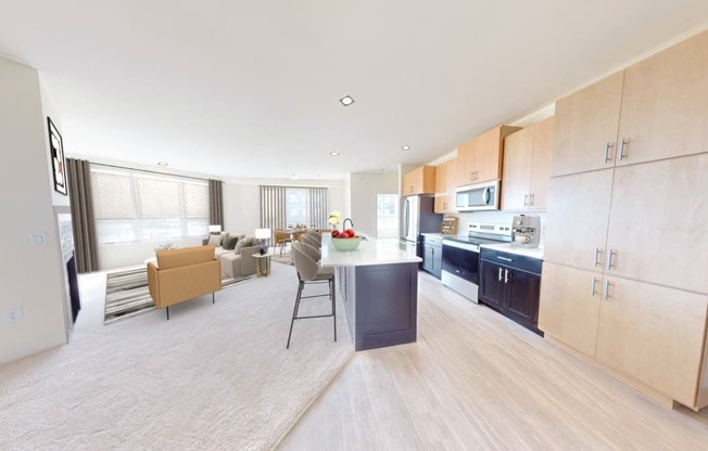 a kitchen and living room with a table and chairs