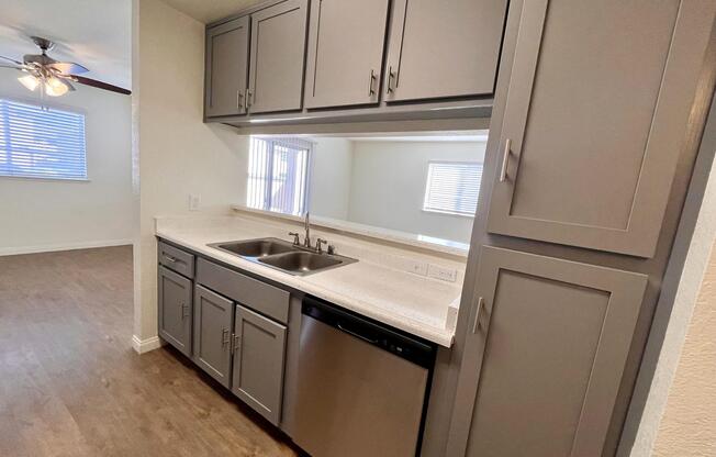 a kitchen with a sink and a window