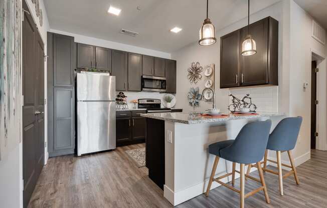 Kitchen With Granite Countertops & White Subway Tile Backsplash