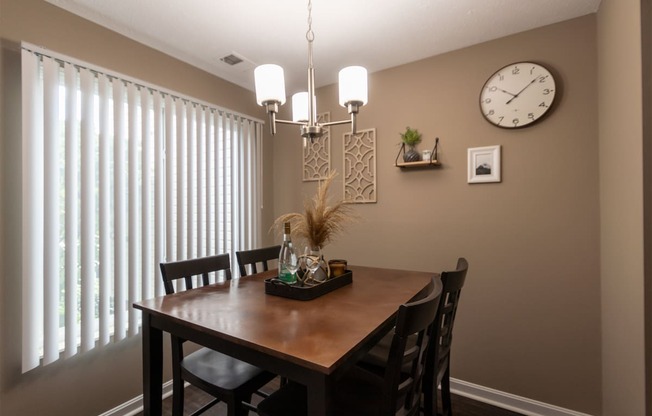 This is a photo of the dining room in the upgraded 650 square foot, 1 bedroom, 1 bath model apartment at Deer Hill Apartments in Cincinnati, Ohio.