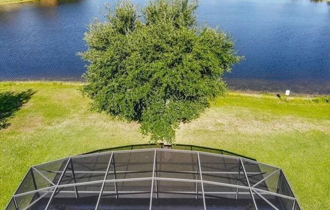 Gorgeous waterfront 4 beds 2 and half baths  home in highly desirable Eagle Creek Community in the heart of Lake Nona.