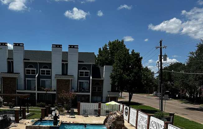A swimming pool is located on the roof of a building.