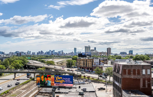 A billboard with the text "Van Gogh Portraits" is visible in the foreground of a cityscape.