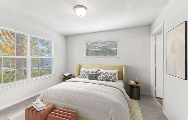 Model Bedroom with Carpet and Window View at Lake Cameron Apartments located in Apex, NC.