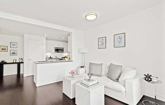 Living room with white couch at 65 Bay Street, Jersey City, NJ, 07302