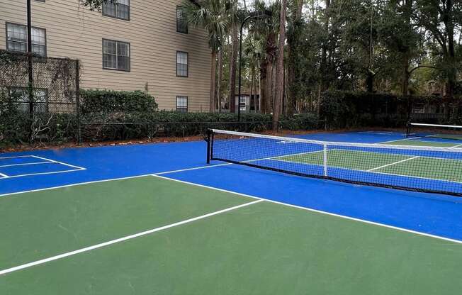 a tennis court is shown on a blue and green tennis court