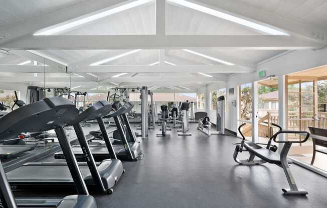 A gym with treadmills and exercise equipment.