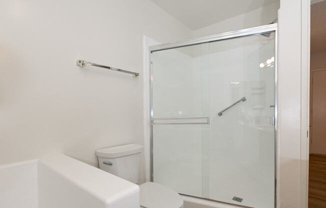 Bathroom with Shower and Hardwood Floors