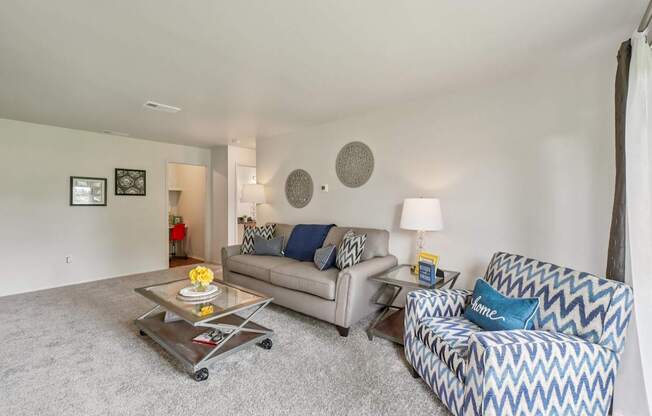 Elevated living room and private patio or balcony at Drawbridge Apartments in Harrison Township, MI.