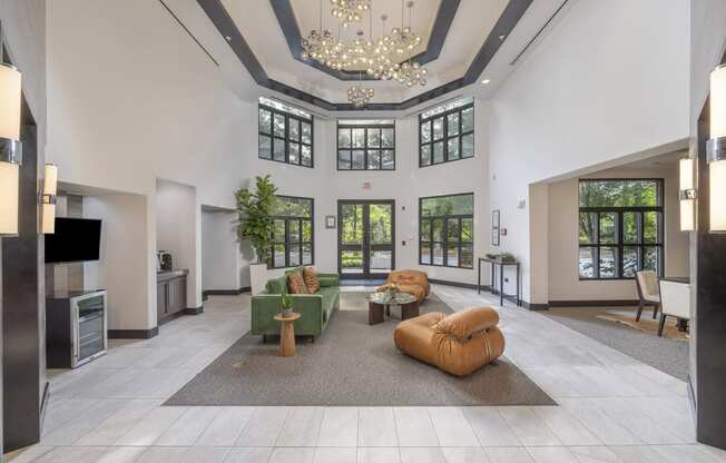 a large lobby with furniture and a chandelier at The Hendrix, Atlanta