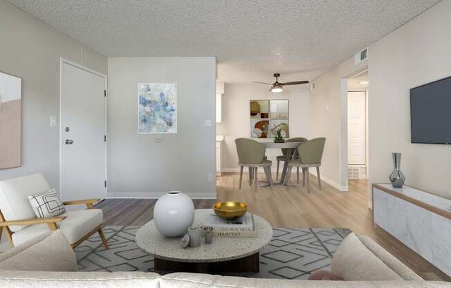 A living room with a white ceiling and a rug on the floor.
