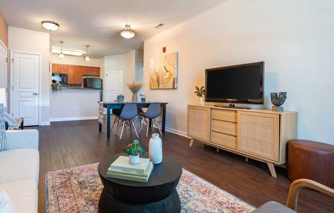 a living room with a couch and a table and a television