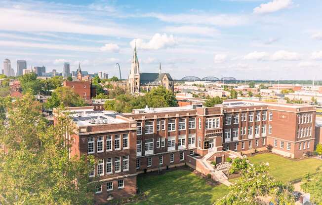 an aerial view of the physics building and the city