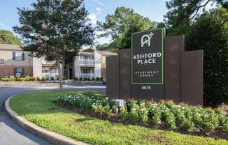 a sign at the entrance of ashwood place apartments