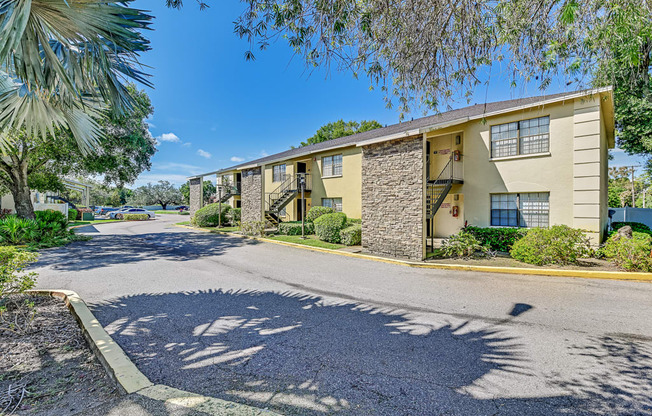 A sunny day at a residential apartment complex with a clear blue sky.