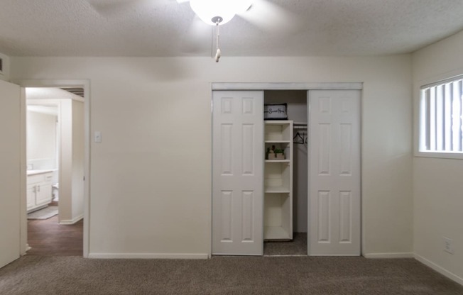 This is a photo of the primary bedroom in the 871 square foot 2 bedroom, 2 bath apartment at Princeton Court Apartments in the Vickery Meadow neighborhood of Dallas, Texas.