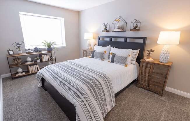 a bedroom with a bed and a window