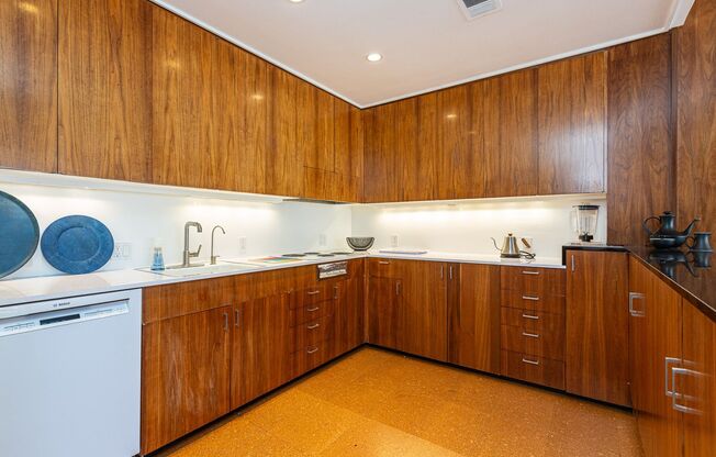 Meticulously maintained 1br + office apartment featuring original 1961 design elements, 24-hour doorman, covered garage parking w/ EV charger and storage.