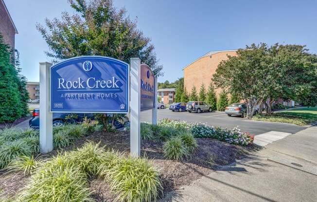 the rock creek sign at the entrance apartments