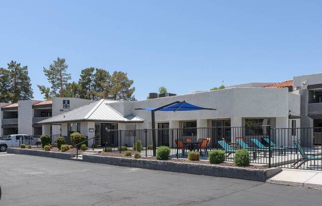 A building with a parking lot in front of it.