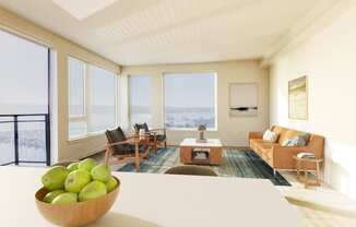 a living room with a couch and a table with a bowl of fruit on top of it at Marina Square, Bremerton, WA, 98337