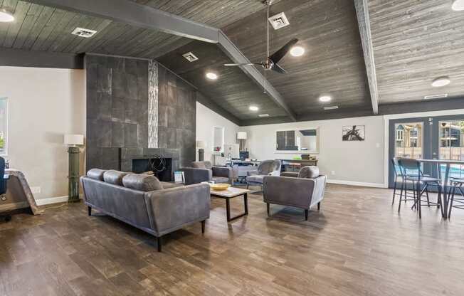 a living room with couches and chairs and a fireplace