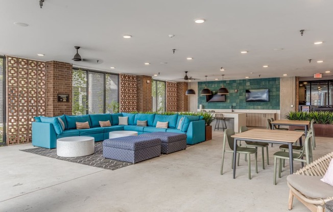 Outdoor lounge with couch and chairs at St. Elmo Apartment in Austin, TX