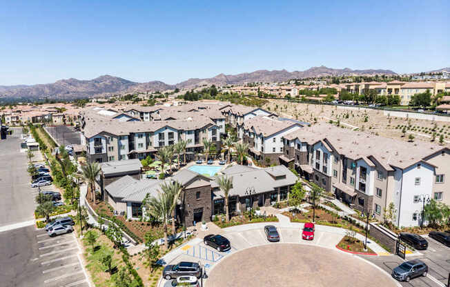 an aerial view of a community with houses and a parking lot