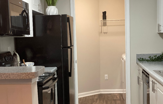 Kitchen and laundry room | Aqua at Sandy Springs | Sandy Springs Apartments