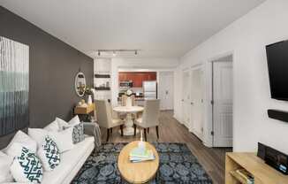 a living room and dining room with a couch and a table