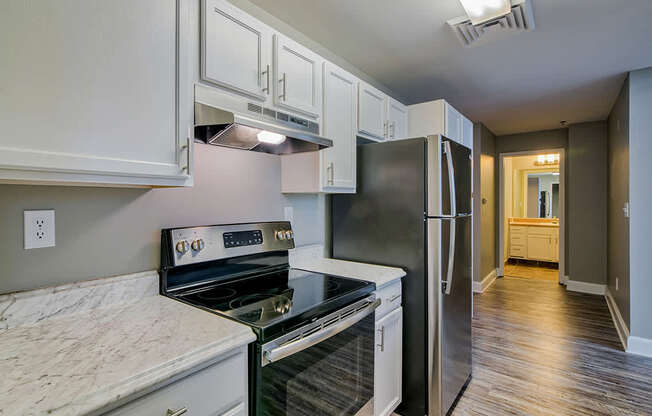 white granite counter tops and stainless steel appliances