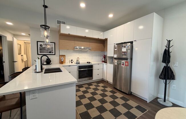 Top‑Floor Corner Condo with Downtown Views — Stylish, Pristine, and Steps From Everything