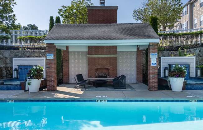 Outdoor Poolside Fireplace at The Residences at Stevens Pond in Saugus, MA 01906