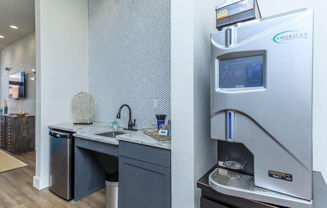 a kitchen with a sink and a mirror