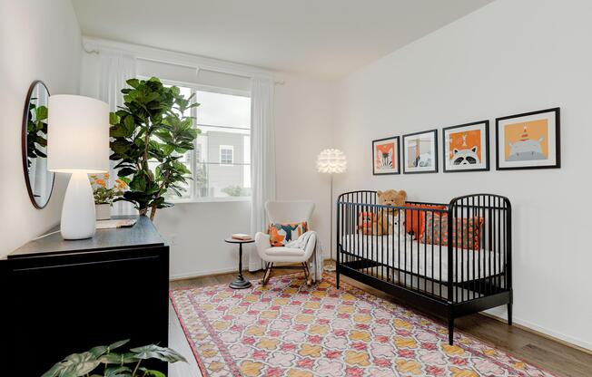 a living room filled with furniture and a bed in a bedroom