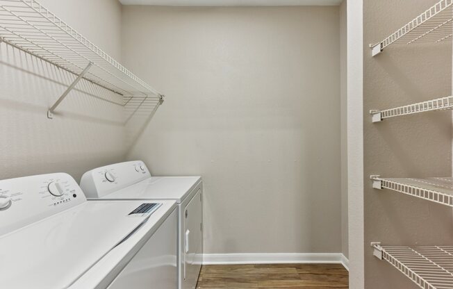 A laundry room with a washer and dryer.