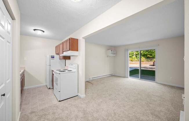 A kitchen area with a white fridge and a white dishwasher.