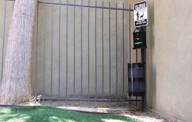 Apartments for Rent Pasadena CA - Brookmore - Gated Outdoor Dog Run With Grass and a Pet Waste Station