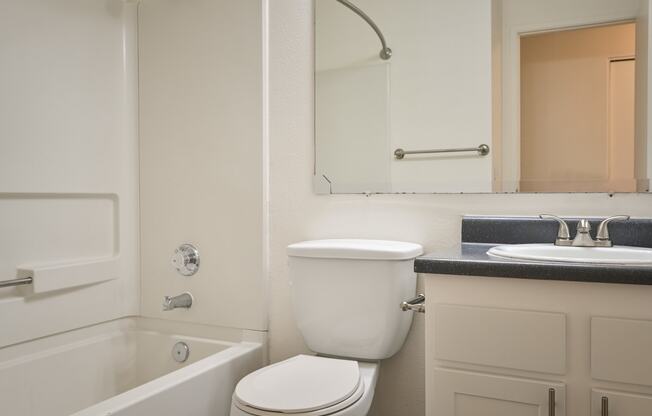 a bathroom with a toilet sink and bathtub