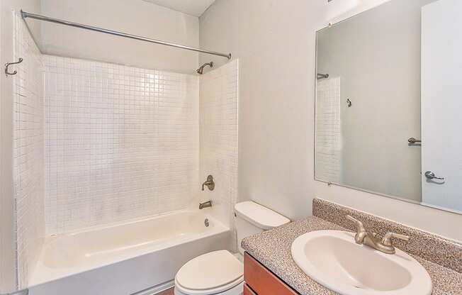 a bathroom with a sink toilet and bathtub