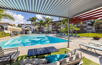 Ocean Breeze Villas Pool with Lounge Chairs