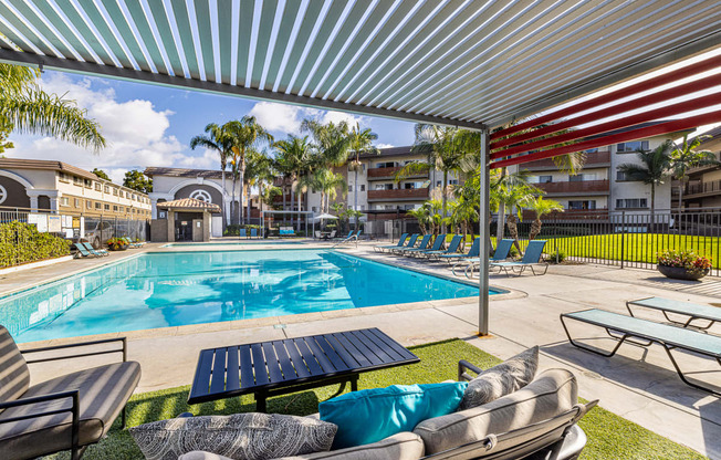 Ocean Breeze Villas Pool with Lounge Chairs