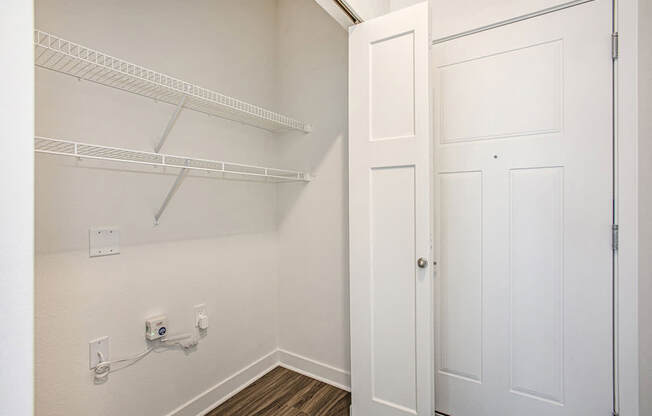 An entry closet with shelves at Meadowbrooke Apartment Homes in Kentwood, MI 49512