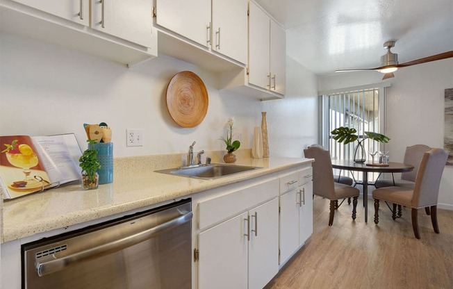 Kitchen Sink, Dishwasher, and Dining Room at Three Crown Apartments, Alameda, CA, California, 94501